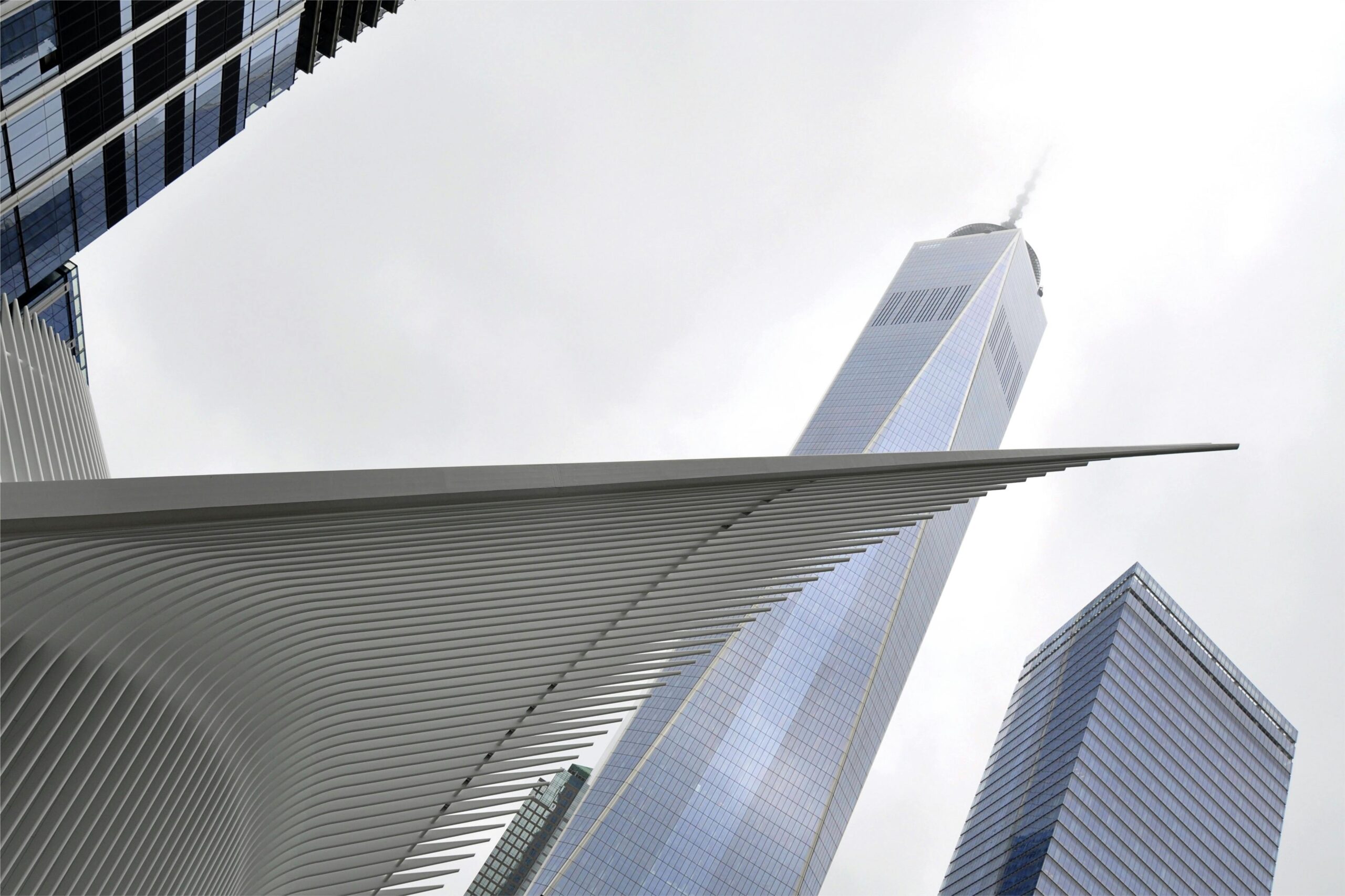 Futuristic view of One World Trade Center and Oculus in New York City.